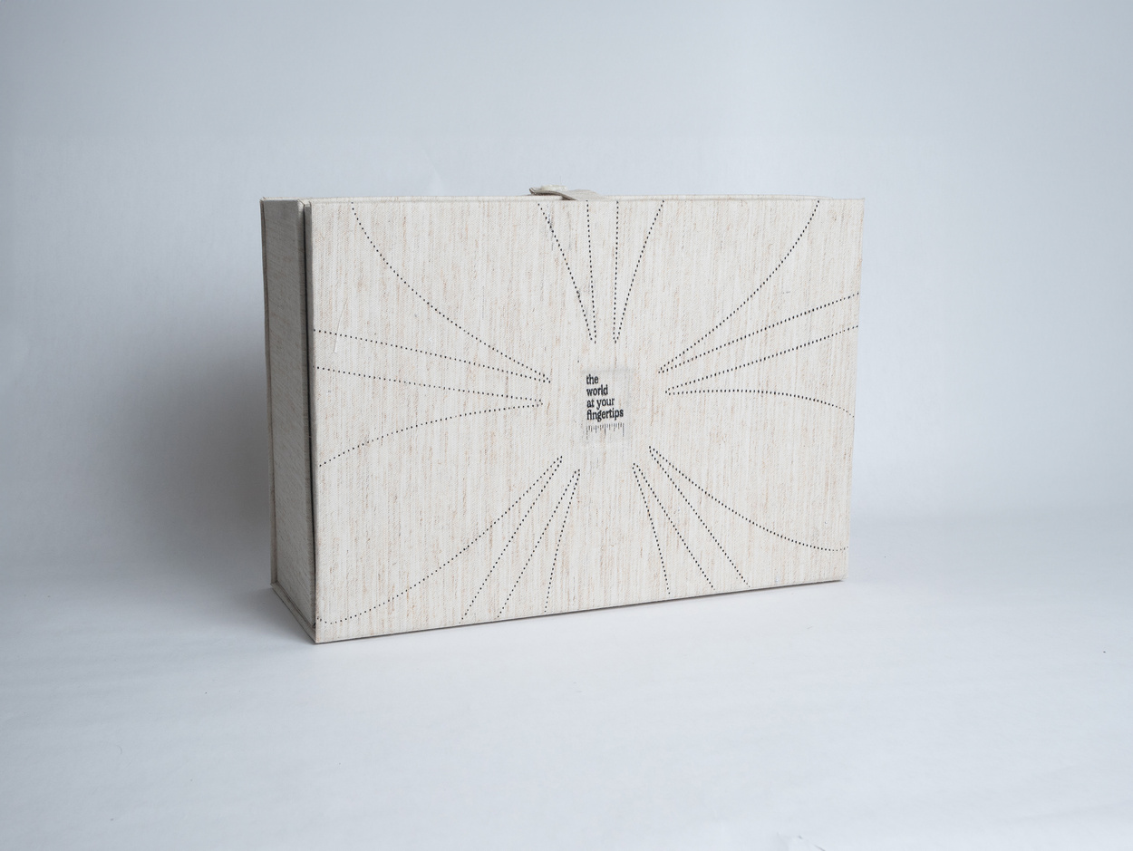 Book spread with miniature ships