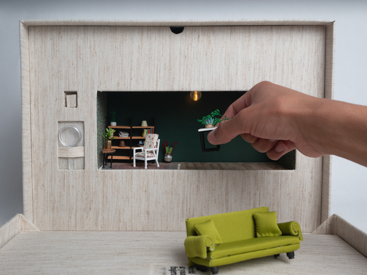 Hands grabbing miniature