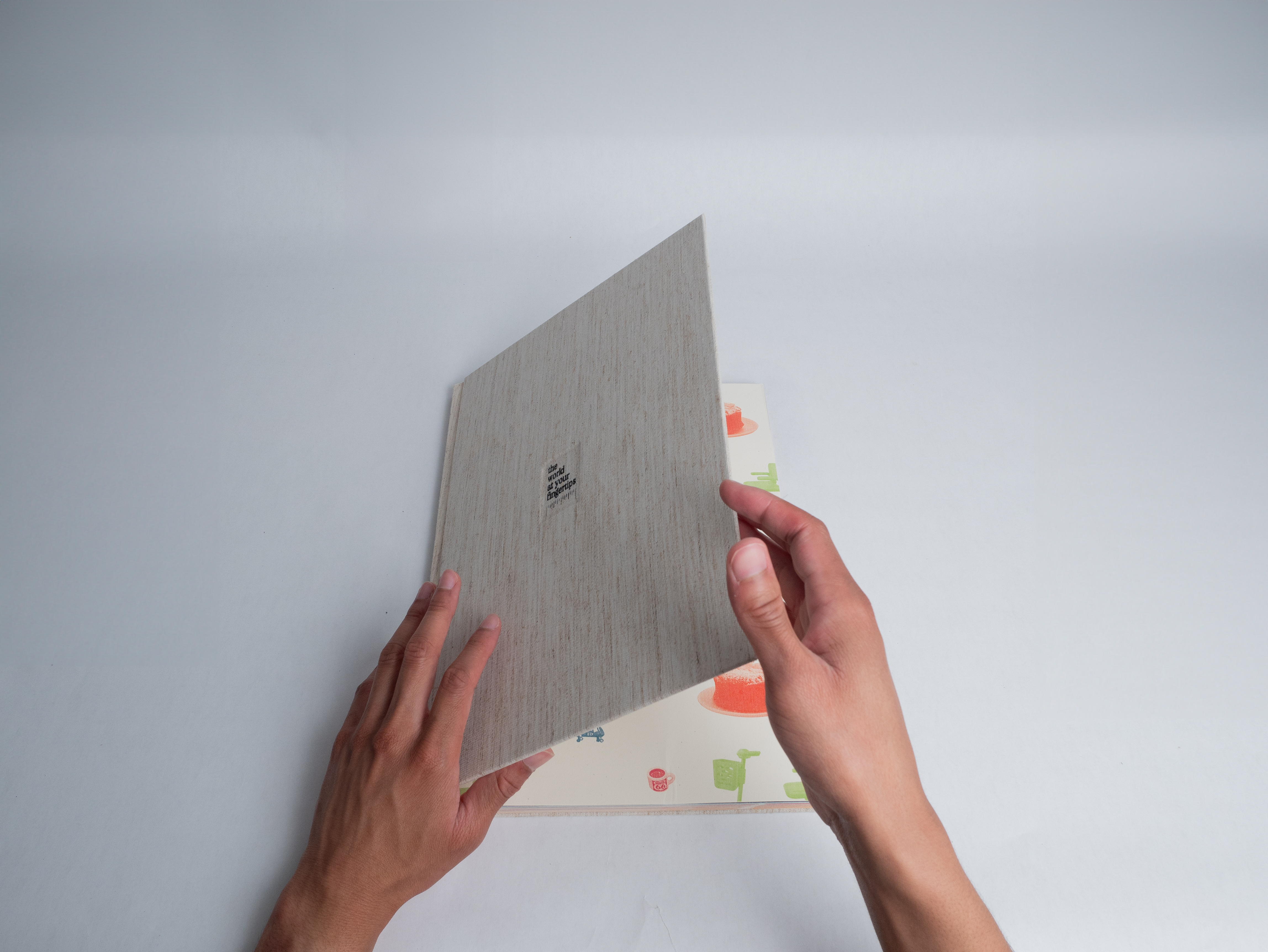 Hands opening large book