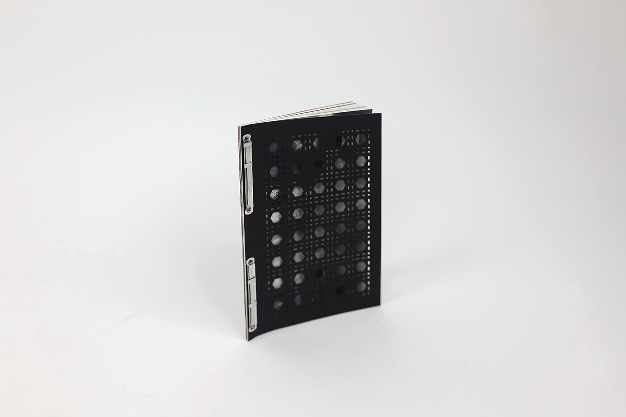 Book standing with cover filled with cut-outs