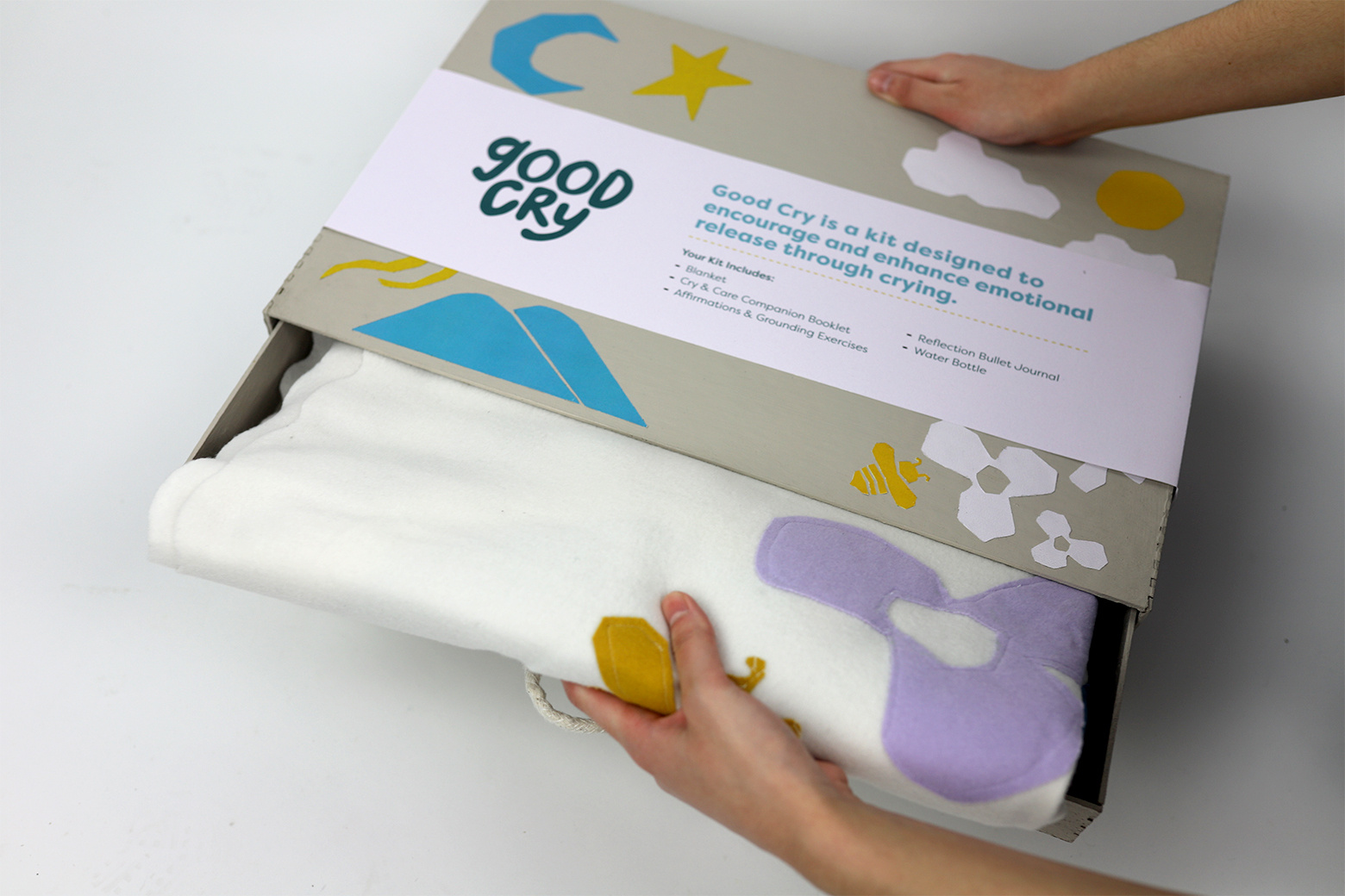 Hand pulling blanket out of box