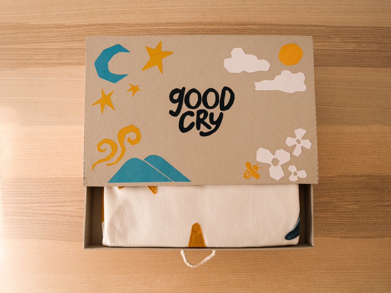 Box slightly open revealing a blanket