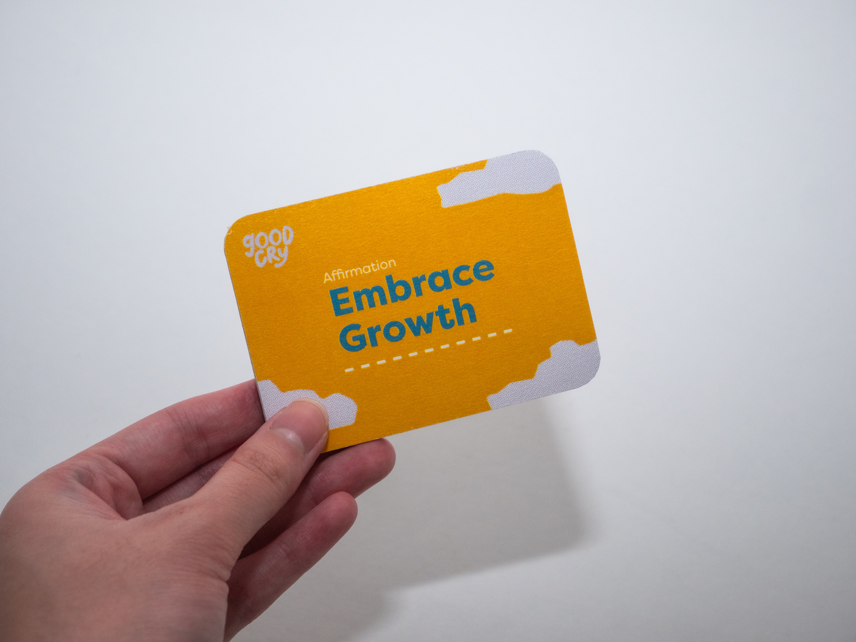 Hand holding yellow card