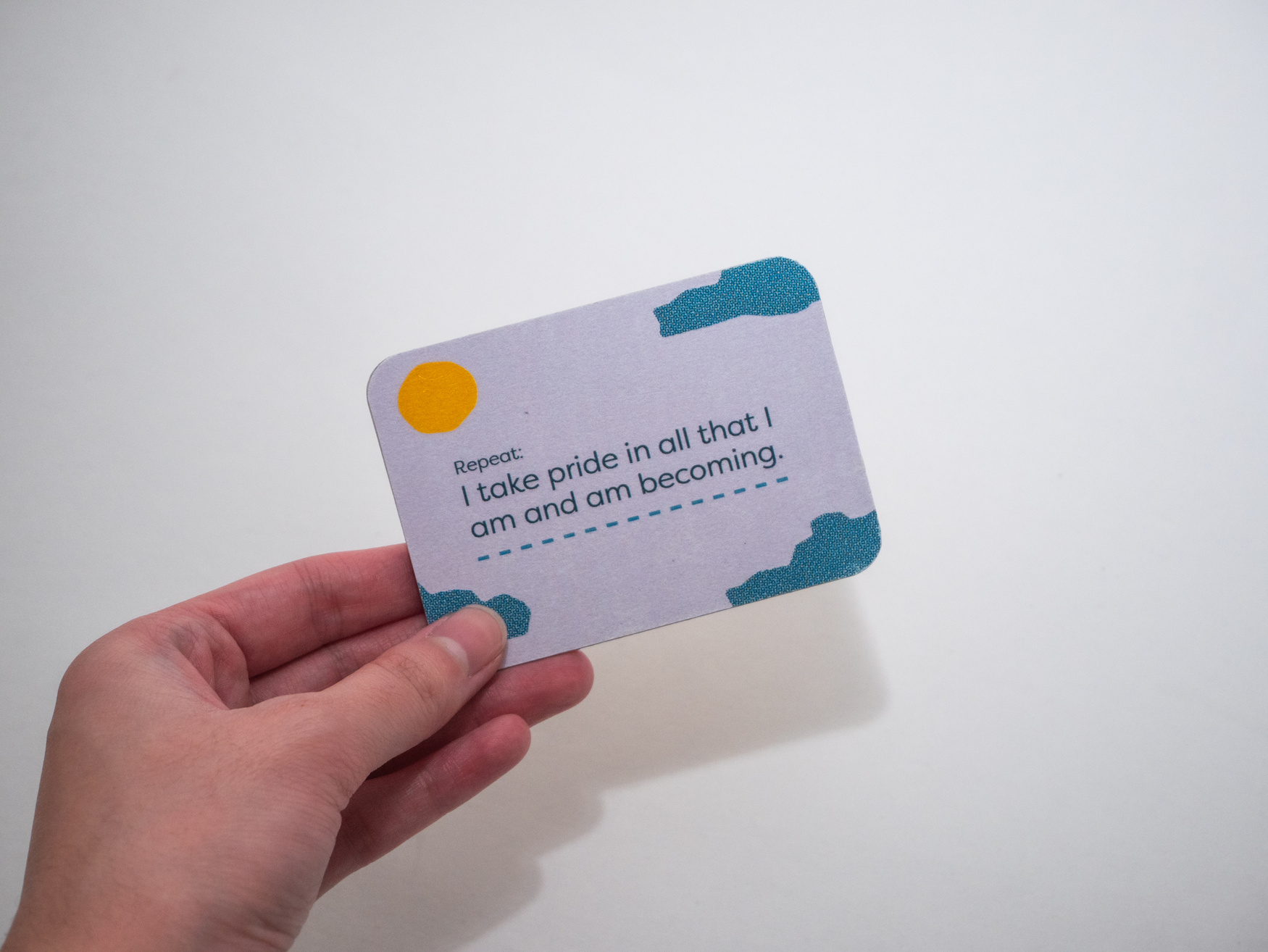 Hand holding purple card