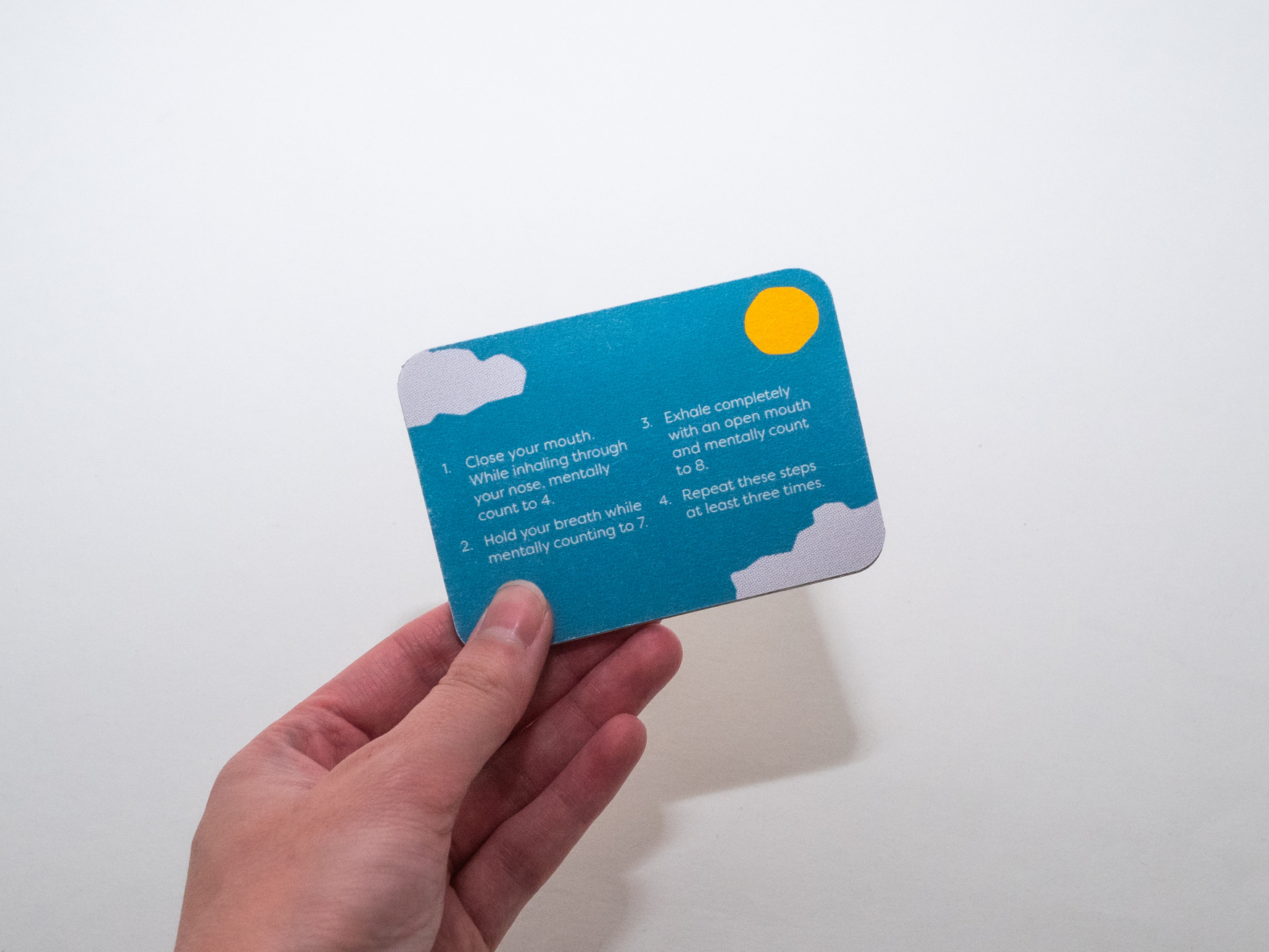 Hand holding blue card